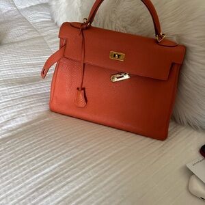 Hermes Orange Kelly 32 with Gold Hardware and shoulder strap (authentic)